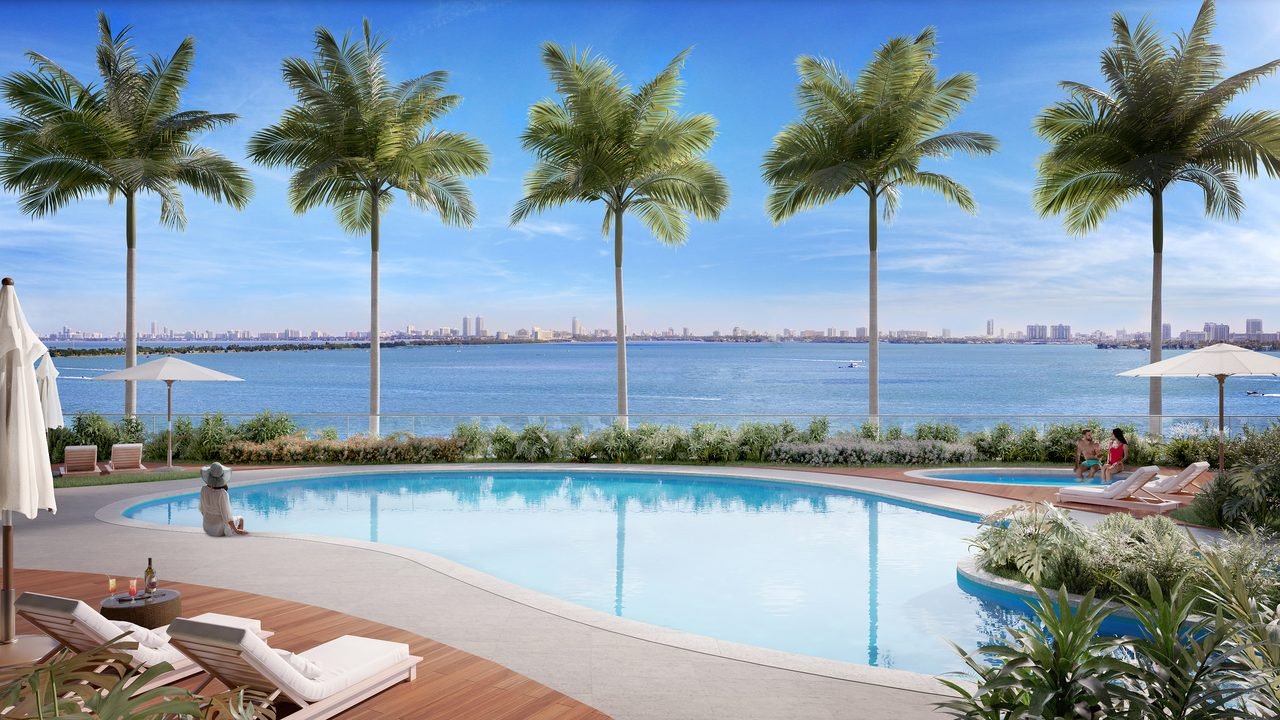 Aria Reserve Miami — bayfront lounge pool with palms and daybeds (artist's rendering)