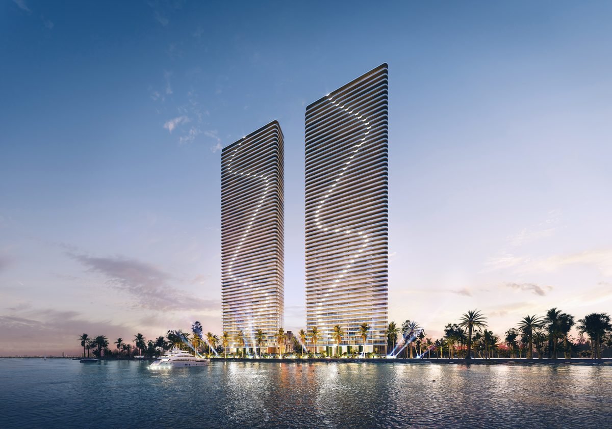 Aria Reserve Miami — twin 62-story waterfront towers at dusk on Biscayne Bay in Edgewater, Miami (artist's rendering)