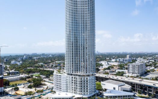 Tall modern building by river