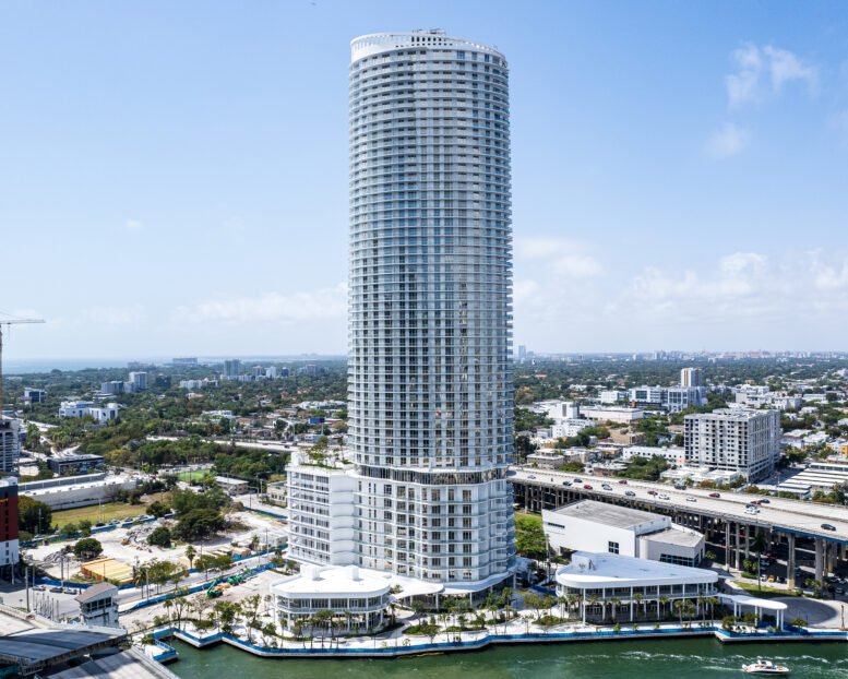 Miami River luxury tower with Brickell skyline in the background