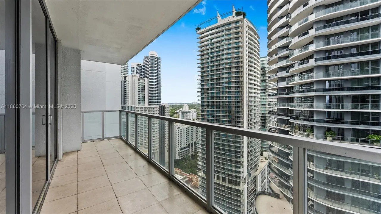 Image of a modern condo balcony with a view of the city